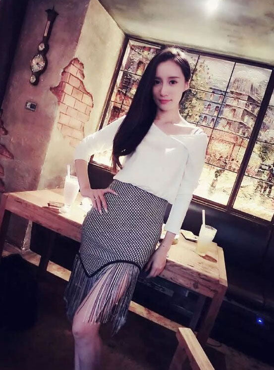 Long Sleeved V Neck T-Shirt and Fringed Irregular Skirt